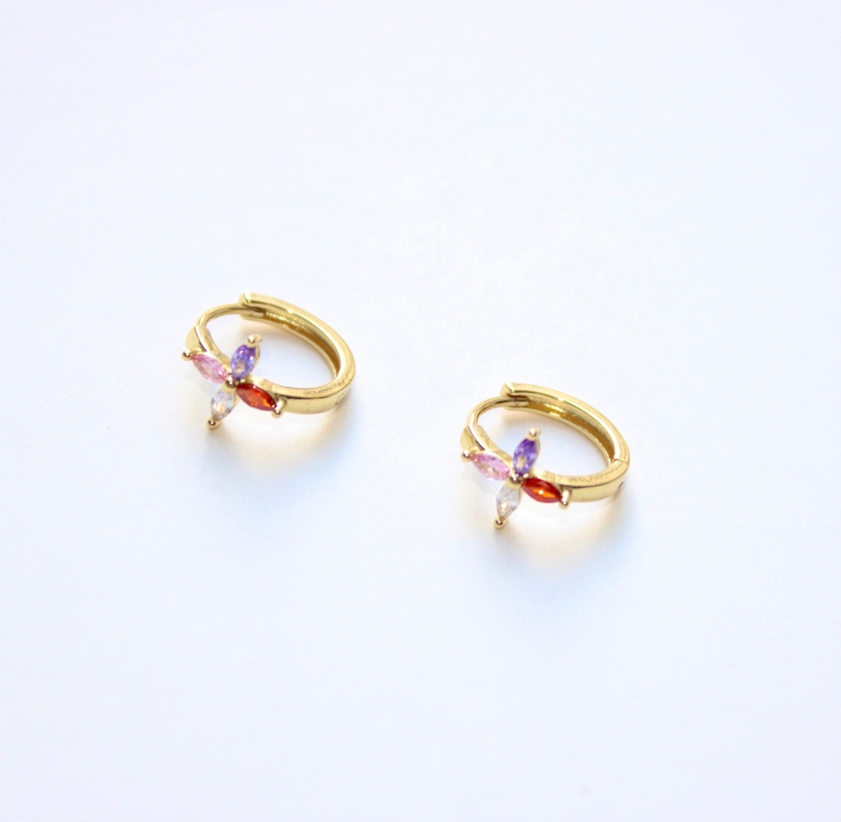 flower huggie earrings in gold
